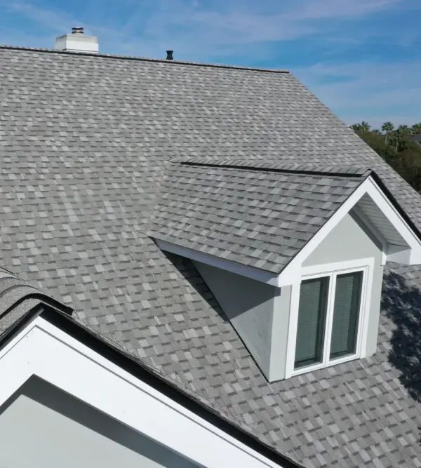 Gray asphalt shingle roof with dormer window