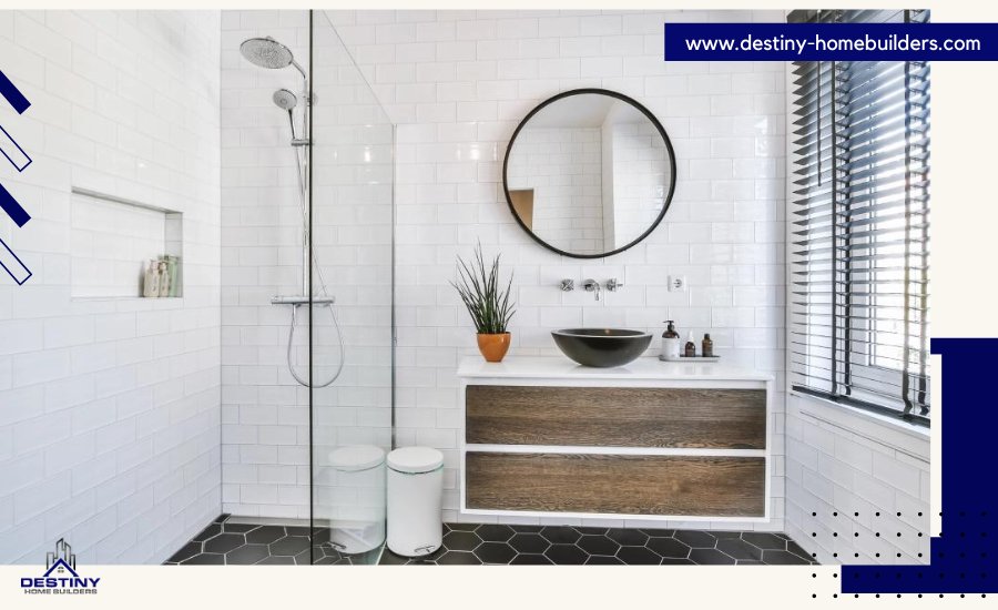 Modern bathroom with white subway tiles, glass shower, and circular mirror