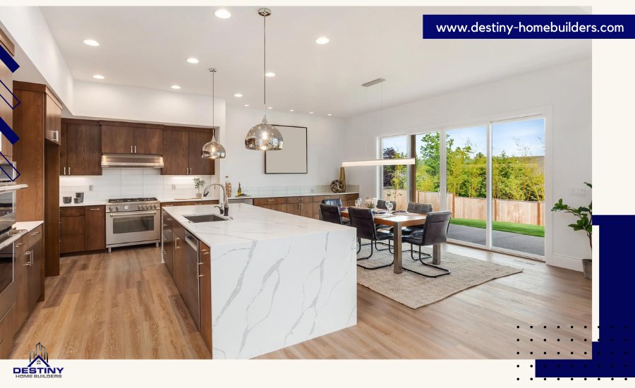 Modern kitchen with white quartz countertops, dark wood cabinets, and spacious dining area