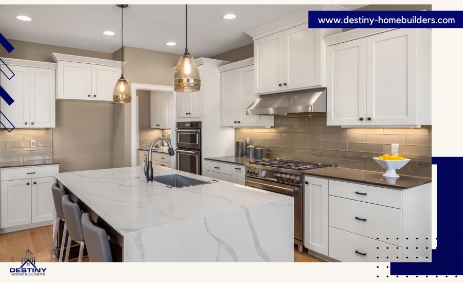 Renovated kitchen of old house with white cabinets, quartz countertops, and island seating