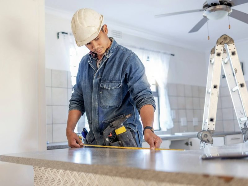construction-measurement-and-handyman-doing-home-repair-renovation-and-building-a-counter-servicjpg