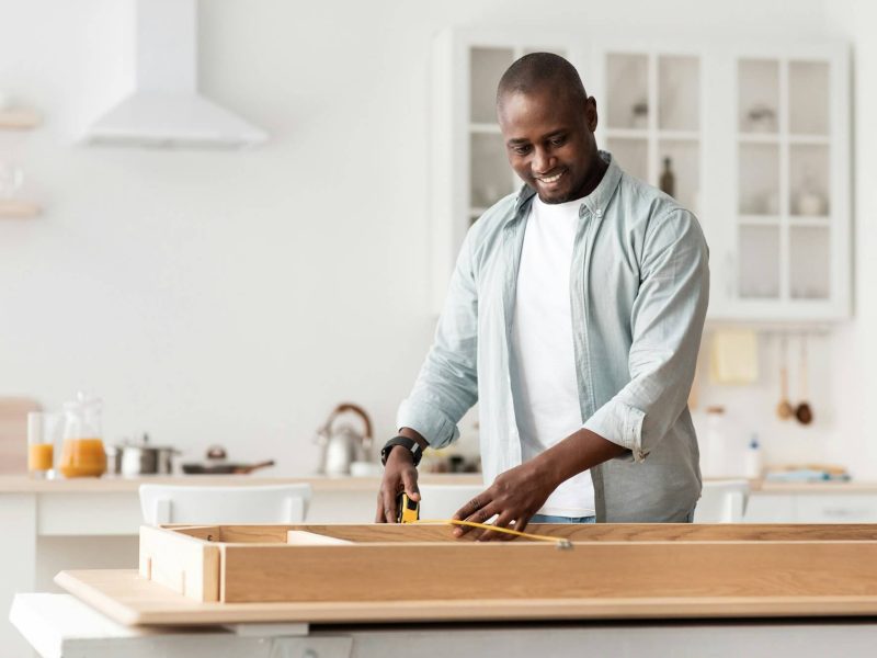 handyman-working-at-home-repairing-assembling-and-renovation-or-new-hobby-man-measuring-new-tablejpg