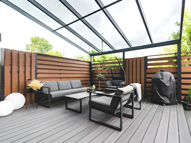 High-end decks & outdoor living area with lighting, furniture, and landscaping